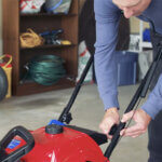 Man adjusting the snow blower