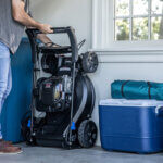 Man using Toro Smart Stow in garage